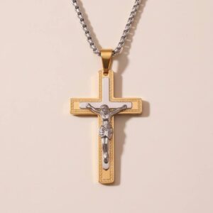 Crucifijo en acero dorado y plateado